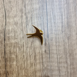 Pin's hirondelle doré