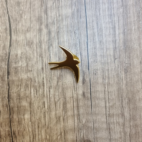 Pin's hirondelle doré
